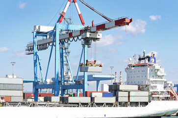 Container ship Docked at the Port of Haifa, Israel.  Gantry Crane working to load unload Freighter Ship