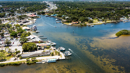 Fototapete - Located along the Gulf of Mexico about 35 miles northwest of Tampa, Port Richey's riverfront landscape blends nature, beaches and terrific shopping with restaurants, culture and business – all wit
