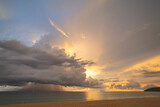 Fototapeta Niebo - rain cloud at sunset over sea water. Evening landscape with sun over sea water.
panorama rain cloud and dramatic twilight sky and cloud sunset background.
Nature image High quality footage
