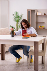 Poster - Young male student drinking alcohol at home