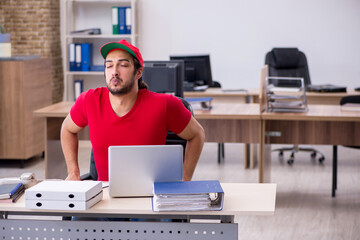 Wall Mural - Young male pizza guy in industrial espionage concept