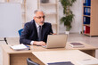 © Elnur - Old male employer in front of white board