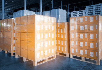 Wall Mural - Interior of Storage Warehouse. Stacked of Package Boxes Wrapped Plastic Flim on pallet rack. L-Shape Pallet Corrugated Paper Cardboard Angle Corner Edge Protector. Shipping Warehouse Logistics.