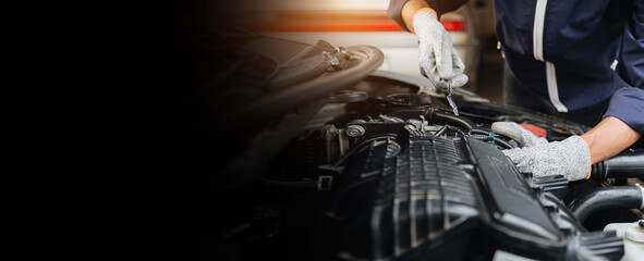 Automobile mechanic repairman hands repairing a car engine automotive workshop with a wrench, car service and maintenance,Repair service.