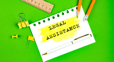 Poster - Text LEGAL ASSISTANCE sign showing on gren background with office tools