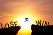 Silhouette man jumping from lose cliff to win cliff with sun and sky , Business and investment concept.