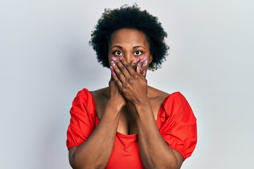 Wall Mural - Young african american woman wearing casual clothes shocked covering mouth with hands for mistake. secret concept.