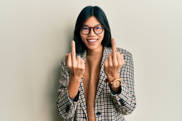 Poster - Young chinese woman wearing business style and glasses showing middle finger doing fuck you bad expression, provocation and rude attitude. screaming excited