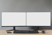 Front View Of A Double Blank White Display.There Is A Mobile Phone, Mouse, Keyboard, Devices For Working During The Coronavirus..Work From Home Concept