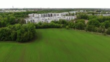 Aerial Shot Of Housing Estate Near Young Wheat Field In Europe