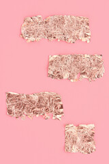 Rose gold scraps on pink background, copy space, design template.