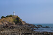 © nuruddean - lighthouse on cliff. landmark of Koh Lanta, Krabi, Thailand.