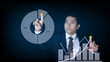 © nuruddean - Businessman pointing spot on the graph finance chart.