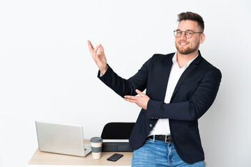 Sticker - Russian man in a office isolated on white background extending hands to the side for inviting to come