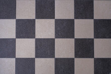 A Black And White Chess Pattern Of A Floor
