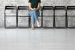 © fizkes - Intern student waiting for exam or interview results in empty corridor. Job candidate sits at recruit agent office in vacant chairs row, expecting meeting with employer for hiring. HR, career concept