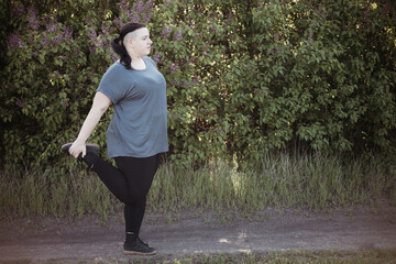 Wall Mural - Overweight woman warming up legs before jogging