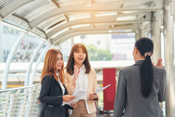 Wall Mural - Business Partner using laptop online meeting team Partnership businessman, businesswoman talking together. Diversity Asian Business Partner online meeting trust teamwork. Asian Business team meeting.