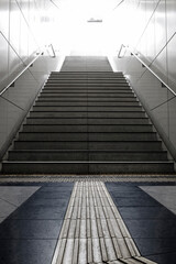 Staircase leading into the blinding day light in Düsseldorf, Germany