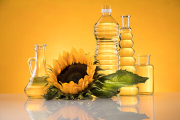 Wall Mural - Bottles of sunflower oil with flower