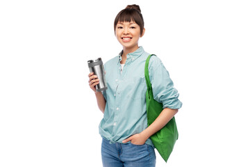 Sticker - sustainability and people concept - asian woman in turquoise shirt with thermo cup for hot drinks and green reusable bag for food shopping over white background