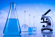 © Sebastian Duda - Laboratory beakers,Science experiment, blue background