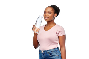 Wall Mural - people concept - portrait of happy smiling young african american woman drinking water from reusable glass bottle over white background