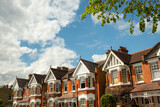 Fototapeta Londyn - Row of typical upmarket British red brick period houses in west London
