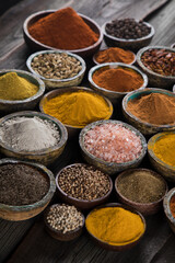  Spices on wooden bowl background