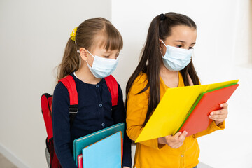 Close-up portrait of two nice attractive girls wearing safety mask. stop influenza disease pandemia