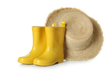 Rubber Boots And Straw Hat Isolated On White Background