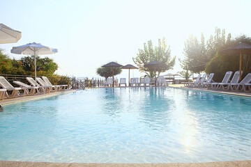 Wall Mural - sun loungers pool sunny day, water summer vacation travel