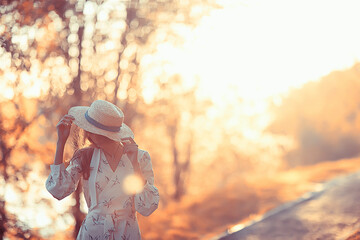 Wall Mural - girl in a straw hat portrait spring freedom / concept spring view model happy people