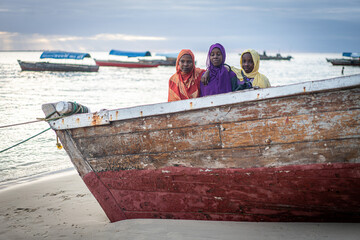 Group of Muslim girls together on the beach