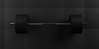 Barbell with chrome handle and black plates in front on floor on black mats background, sport, fitness, exercise or weightlift concept, top view