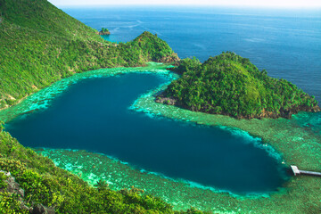 karawapop, a heart-shaped lagoon in the cluster of west papua island, raja ampat indonesia