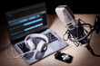 © Brian Jackson - Podcast microphone and laptop computer in recording studio