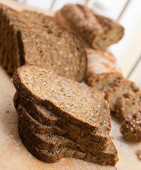 Wall Mural - fresh loaf of bread on wooden board