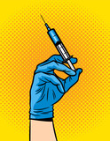 Fototapeta Młodzieżowe - Vector color illustration in pop art style. A female hand in a medical glove holds a syringe. Vaccination of the population. The doctor is ready to give an injection