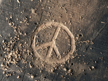 The Peace Symbol Carved In Wood With Chisels. Peace Concept, Global Solidarity