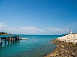 Landscape summer walkway bridge walk sea and also small port. And small boat moored with view of blue sea, clear sky clean, suitable holiday travel At Gulf Thailand 