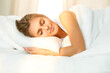 © volha_r - Beautiful blonde girl sleeping sweetly in sunny bedroom on a white bed. Holyday comfort and Rest concepts