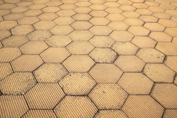 Wall Mural - yellow hexagon walkway. Street being paved yellow tiles for background