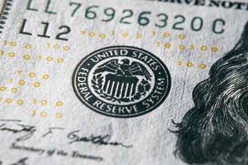 macro photo of federal reserve system symbol on one hundred dollar bill. shallow focus. close-up with fine and sharp texture