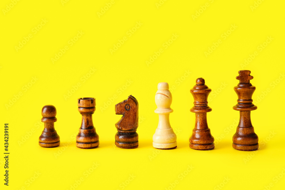 Chess pieces on color background