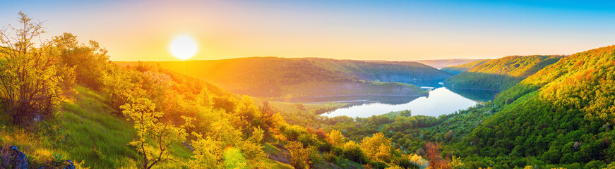 Vivid sunrise landscape in the national nature park Podilski Tovtry, canyon and Studenytsia river is tributary of Dnister river, view from above