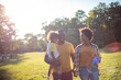 © liderina - African American family having fun outdoors. Smiling and happy day.