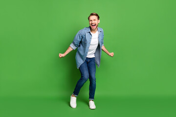 Sticker - Full length body size photo of overjoyed guy cheerful dancing at party on weekend isolated bright green color background