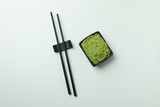 Fototapeta  - Chopsticks and wasabi sauce on white background
