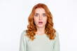 Photo portrait of red haired girl amazed staring with opened mouth in casual outfit isolated white color background